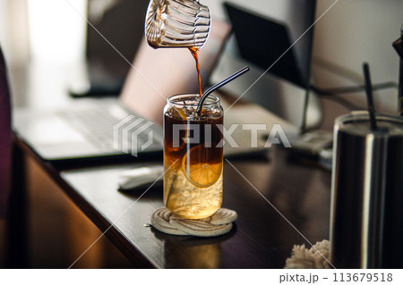 Iced coffee lemon,Iced coffee and lemon in a glass Iced coffee lemon,Iced coffee and lemon in a glass 113679518