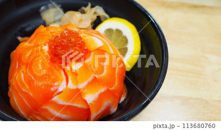Cut out image of a bowl of sea food sushi on a wooden background. Use for illustrations, background images, or copy space. Cut out image of a bowl of sea food sushi on a wooden background. Use for illustrations, background images, or copy space. 113680760
