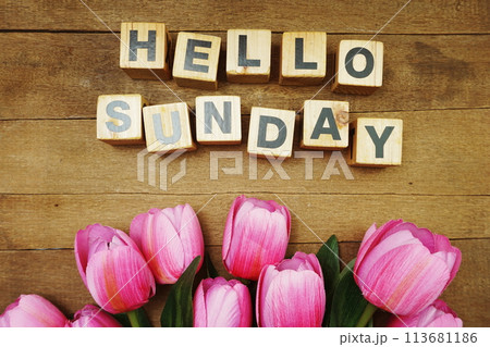 Hello Sunday alphabet letters on wooden background 113681186