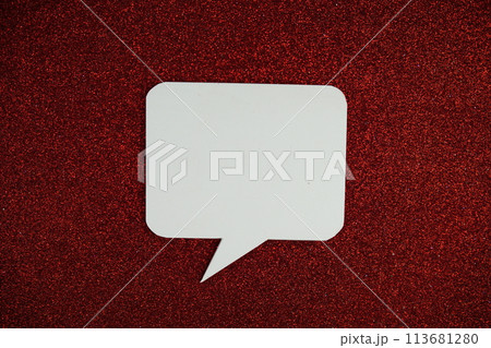 White Speech bubble mockup top view on red glitter background 113681280