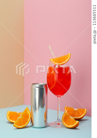 Cocktail with fresh oranges on a blue background 113685511