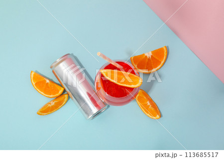 Cocktail with fresh oranges on a blue background Cocktail with fresh oranges on a blue background 113685517