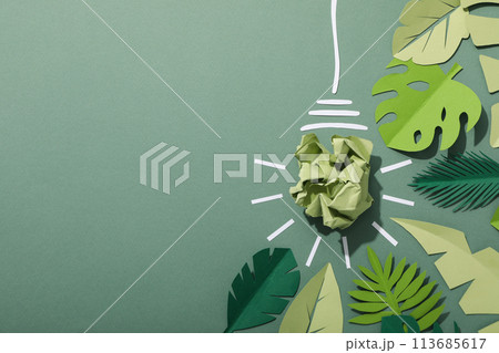 A light bulb made of crumpled paper, the concept of an eco house 113685617