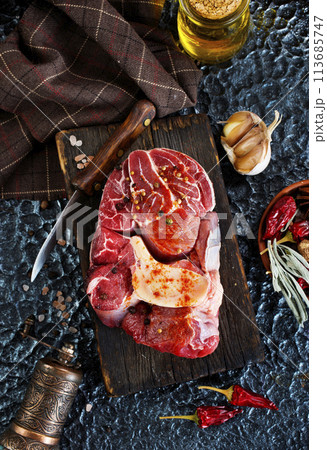 raw meat on board, meat with spice 113685747