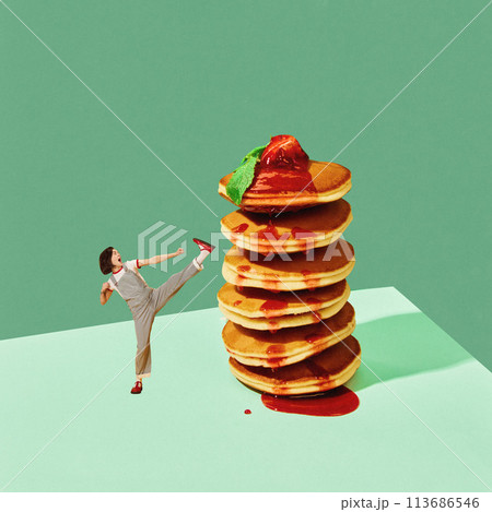 Poster. Contemporary art collage. Young woman in retro fashion outfit fighting with stack of pancakes against mint background. 113686546