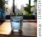 Glass of pure water on kitchen table 113687214