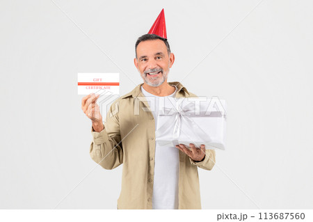 Senior man with gift certificate and present Senior man with gift certificate and present 113687560