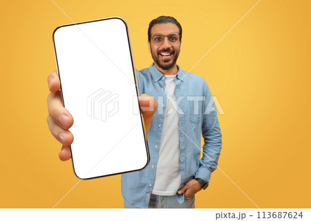 Man showing blank smartphone screen Man showing blank smartphone screen 113687624