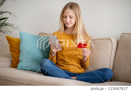 Teen Girl Shopping Online With Credit Card and Smartphone 113687627