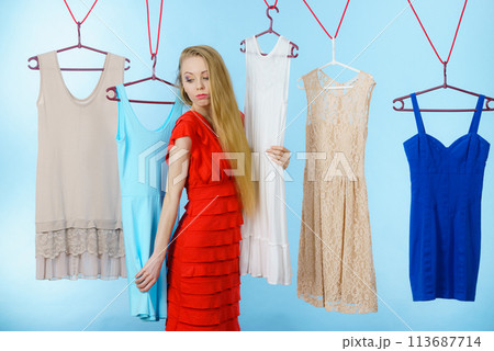 Woman choosing clothes in shop 113687714