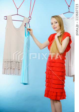 Woman choosing clothes in shop 113687723