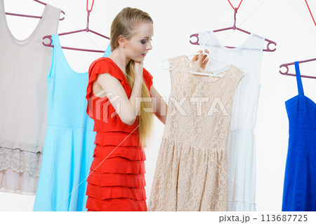 Woman choosing clothes in shop 113687725