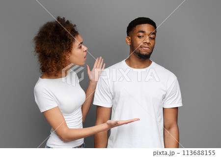 Young black woman arguing with her boyfriend that ignoring her Young black woman arguing with her boyfriend that ignoring her 113688155