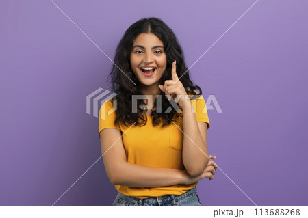 Energetic woman with idea finger pointing up Energetic woman with idea finger pointing up 113688268