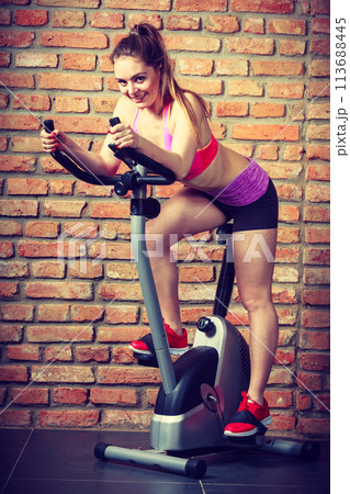 Active woman doing sport biking. 113688445