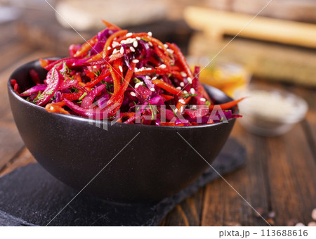 Fresh vegetable salad with sauerkraut cabbage, grated carrots and beetroots Fresh vegetable salad with sauerkraut cabbage, grated carrots and beetroots 113688616