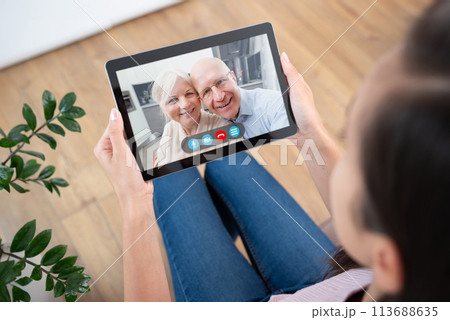 Woman using video chat, parents video call Woman using video chat, parents video call 113688635