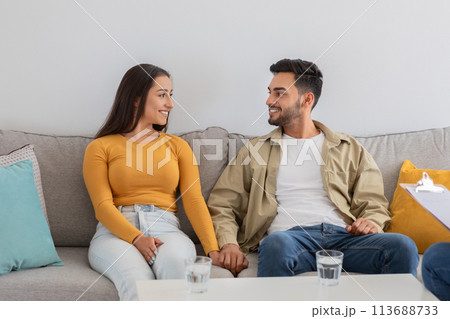 Young couple relaxing on couch at counselor office 113688733