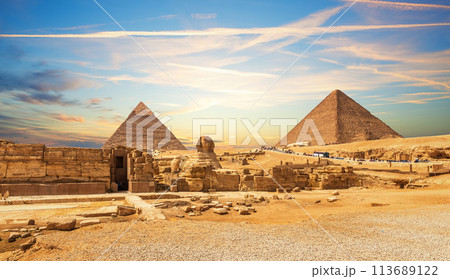 The Great Sphinx next to the Pyramids of Egypt at sunset, Giza desert 113689122