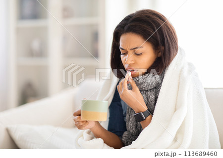 Sick african american woman feeling unwell at home 113689460
