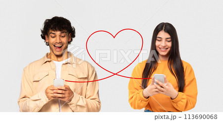 A man in a beige jacket and a woman in an orange sweater, both with joyful expressions A man in a beige jacket and a woman in an orange sweater, both with joyful expressions 113690068