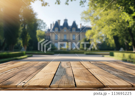 Weathered wooden product table display, french castle on background 113691225