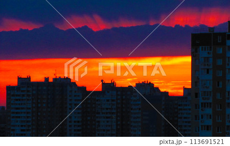 Evening city with red rays and sky 113691521