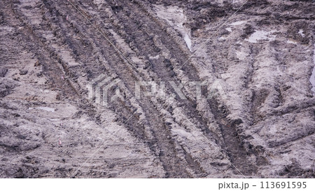 Kiev, Ukraine, October 17, 2018: Workers in the mud of a construction site at the stage of excavation; construction of a supermarket AUCHAN Kiev, Ukraine, October 17, 2018: Workers in the mud of a construction site at the stage of excavation; construction of a supermarket AUCHAN 113691595
