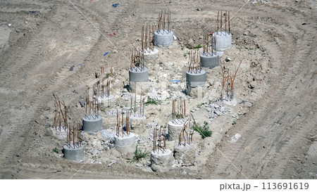 Kiev, Ukraine March 13, 2019: Foundation zero cycle construction, concrete piles at construction site Kiev, Ukraine March 13, 2019: Foundation zero cycle construction, concrete piles at construction site 113691619