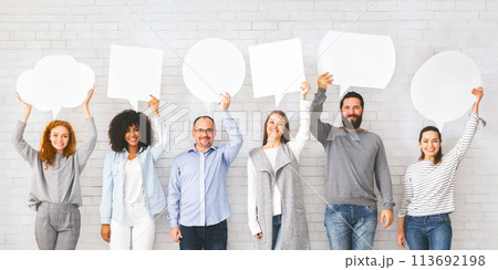 Diverse people holding empty speech bubbles above their heads, free space 113692198