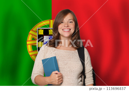 Attractive woman student against Portuguese flag background. Travel, education and learn language  113696837