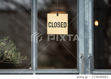 sorry we are closed sign hanging outside a restaurant, store, office or other 113698865