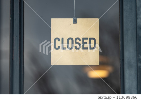 sorry we are closed sign hanging outside a restaurant, store, office or other 113698866