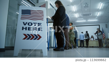 Vote here sign on the floor in polling station office 113699662