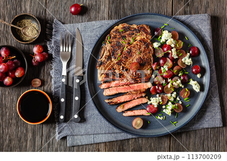 fried beef steak with salad of grape, cheese 113700209