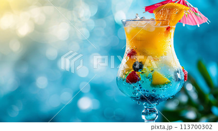 a vibrant cocktail steals the spotlight against a backdrop of clear, warm colors 113700302