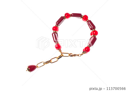 Bracelet with garnet and coral isolated on white background Bracelet with garnet and coral isolated on white background 113700566