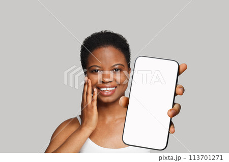 Fresh healthy woman holding smartphone with white empty blank screen display  113701271