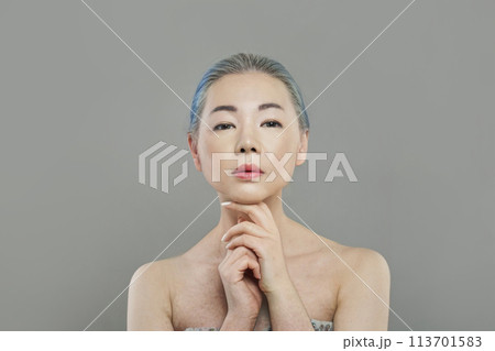 Beautiful asian mid adult woman portrait Beautiful asian mid adult woman portrait 113701583