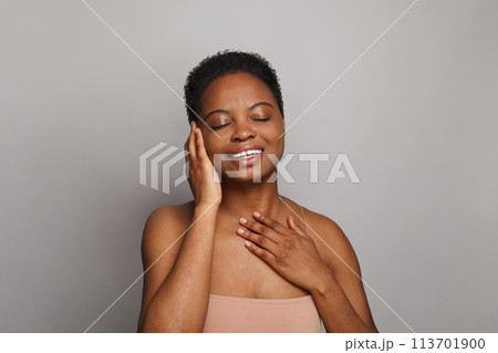 Lovely healthy lady with dark clean fresh skin on white background. Advertising, product placement 113701900