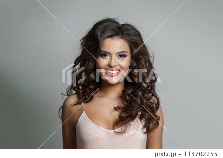 Happy young woman with brown hair and make-up, beauty fashion portrait closeup 113702255