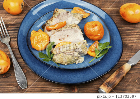 Baked pork meat with medlar or loquat. 113702397