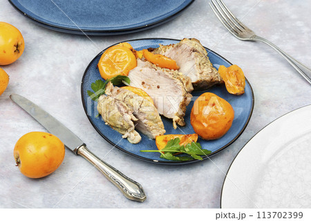 Baked pork meat with medlar. 113702399