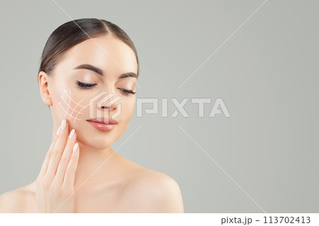 Clean female face with healthy skin and cosmetology lines, medicine and plastic surgery concept Clean female face with healthy skin and cosmetology lines, medicine and plastic surgery concept 113702413