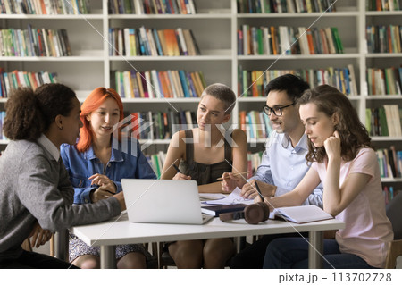 Group of multiethnic students listening opinion of Hispanic schoolmate 113702728