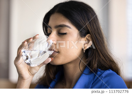 Beautiful Indian girl with closed eyes enjoying fresh pure water Beautiful Indian girl with closed eyes enjoying fresh pure water 113702776
