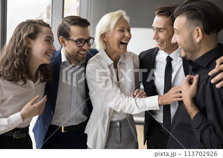 Five diverse enthusiastic employees celebrate successful project launch Five diverse enthusiastic employees celebrate successful project launch 113702926