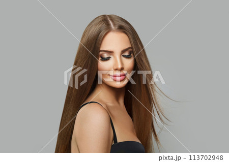 Beautiful fashion model woman with long healthy hairstyle, fresh shiny skin and makeup 113702948