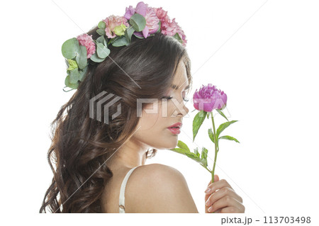 Good-looking healthy woman with clean fresh skin, wavy long hair and flower wreath, beauty portrait Good-looking healthy woman with clean fresh skin, wavy long hair and flower wreath, beauty portrait 113703498