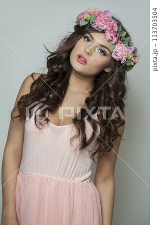Good-looking fashion brunette model with make-up, fresh clear skin, shiny long wavy hairstyle Good-looking fashion brunette model with make-up, fresh clear skin, shiny long wavy hairstyle 113703504